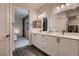 Spa-like bathroom with double vanity and view to bedroom at 9181 Theodore Ct, Las Vegas, NV 89178