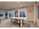 Dining area with white table and chairs, with backyard access at 9181 Theodore Ct, Las Vegas, NV 89178