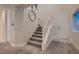 Bright entryway with staircase and neutral carpeting at 9181 Theodore Ct, Las Vegas, NV 89178