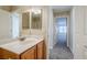 Bathroom with double vanity, and access to hallway and bedroom at 9494 Stillwater Bend Ln, Las Vegas, NV 89178