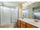 Bathroom boasts double sinks and a shower/tub combo at 9494 Stillwater Bend Ln, Las Vegas, NV 89178