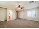 Large bedroom with ceiling fan and ensuite bathroom at 9494 Stillwater Bend Ln, Las Vegas, NV 89178