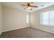 Bedroom with ceiling fan, window with blinds, and carpet flooring at 9494 Stillwater Bend Ln, Las Vegas, NV 89178