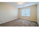 Spacious bedroom with neutral walls, carpet flooring, and a window with blinds at 9494 Stillwater Bend Ln, Las Vegas, NV 89178