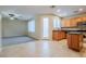 Eat-in kitchen with wood cabinets and island at 9494 Stillwater Bend Ln, Las Vegas, NV 89178