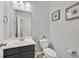 Small bathroom with toilet, sink, and vanity at 10330 Glacier Mist Ave, Las Vegas, NV 89149