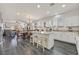 Open kitchen with island and view into living room at 10330 Glacier Mist Ave, Las Vegas, NV 89149