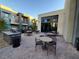 Outdoor kitchen and dining area with grills and seating at 11251 Hidden Peak Ave # 212, Las Vegas, NV 89135