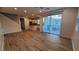 Open living room with hardwood floors and kitchen island view at 11251 Hidden Peak Ave # 212, Las Vegas, NV 89135