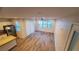 Bright living room with wood-look floors and sliding glass door access at 11251 Hidden Peak Ave # 212, Las Vegas, NV 89135