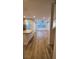 Open living room and kitchen with wood-look floors at 11251 Hidden Peak Ave # 212, Las Vegas, NV 89135