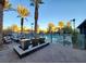 Community pool with fountains, lounge chairs, and palm trees at 11251 Hidden Peak Ave # 212, Las Vegas, NV 89135