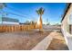 Backyard view with a pathway and wooden fence at 133 Dogwood St, Henderson, NV 89015