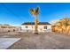 Backyard with a large empty space and a palm tree at 133 Dogwood St, Henderson, NV 89015