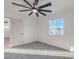 Bright bedroom with ceiling fan, carpet, and window at 133 Dogwood St, Henderson, NV 89015