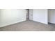 Bright bedroom with neutral carpeting and ample closet space at 133 Dogwood St, Henderson, NV 89015