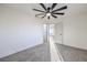 Bright bedroom with carpeted floor and ceiling fan at 133 Dogwood St, Henderson, NV 89015