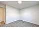 Simple bedroom with carpet and door to hallway at 133 Dogwood St, Henderson, NV 89015