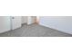 Grey carpeted bedroom with open door at 133 Dogwood St, Henderson, NV 89015