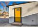 Bright yellow door with modern accents in a newly remodeled home at 133 Dogwood St, Henderson, NV 89015