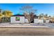 Stunning curb appeal with a remodeled white house, drought-tolerant landscaping, and a new driveway at 133 Dogwood St, Henderson, NV 89015