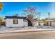 Modern, remodeled home with white exterior and black accents at 133 Dogwood St, Henderson, NV 89015