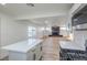 Open concept kitchen with island and view of living room at 133 Dogwood St, Henderson, NV 89015