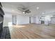 Bright and airy living room with hardwood floors and a modern fireplace at 133 Dogwood St, Henderson, NV 89015