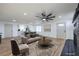 Virtually staged living room with modern furniture and fireplace at 133 Dogwood St, Henderson, NV 89015