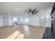 Open concept living room with hardwood floors, ceiling fan and lots of natural light at 133 Dogwood St, Henderson, NV 89015