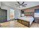 Main bedroom with wood flooring and an ensuite bathroom at 1717 Imperial Cup Dr, Las Vegas, NV 89117