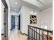 Upstairs hallway with dark gray doors and hardwood floors at 1717 Imperial Cup Dr, Las Vegas, NV 89117