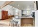 Modern kitchen with curved island and wood accents at 1717 Imperial Cup Dr, Las Vegas, NV 89117