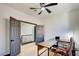 Home office with L-shaped desk and ceiling fan at 1717 Imperial Cup Dr, Las Vegas, NV 89117