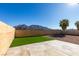 Backyard with artificial turf, concrete patio, and mountain view at 1850 Banaba Ln, Las Vegas, NV 89156