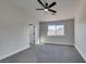 Bright bedroom with ceiling fan and large window at 1850 Banaba Ln, Las Vegas, NV 89156