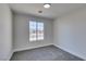 Bright bedroom with grey carpet and large window at 1850 Banaba Ln, Las Vegas, NV 89156