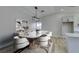 Virtually staged dining room with marble table and modern chairs at 1850 Banaba Ln, Las Vegas, NV 89156