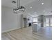 Dining room features modern chandelier and kitchen access at 1850 Banaba Ln, Las Vegas, NV 89156