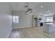 Dining room features wood-look floors and a modern chandelier at 1850 Banaba Ln, Las Vegas, NV 89156