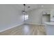 Dining room with modern light fixture and wood-look floors at 1850 Banaba Ln, Las Vegas, NV 89156