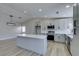 Modern kitchen with island, stainless steel appliances, and white cabinets at 1850 Banaba Ln, Las Vegas, NV 89156