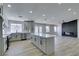 Modern kitchen with island, stainless steel appliances, and white cabinets at 1850 Banaba Ln, Las Vegas, NV 89156