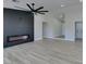 Spacious living area with fireplace and wood-look floors at 1850 Banaba Ln, Las Vegas, NV 89156