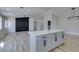 Bright living room featuring a modern fireplace and kitchen island at 1850 Banaba Ln, Las Vegas, NV 89156