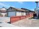 Single-story house with a red wooden fence and attached garage at 1861 Ridgefield Dr, Las Vegas, NV 89108