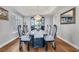 Elegant dining room with a dark wood table and crystal chandelier at 1926 Dresden Ct, Henderson, NV 89014