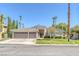 Single-story house with two-car garage and landscaped yard at 1926 Dresden Ct, Henderson, NV 89014