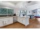 Open concept kitchen with island, stainless steel appliances, and hardwood floors at 1926 Dresden Ct, Henderson, NV 89014