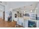 Modern kitchen with white cabinets, granite counters and breakfast bar at 1926 Dresden Ct, Henderson, NV 89014